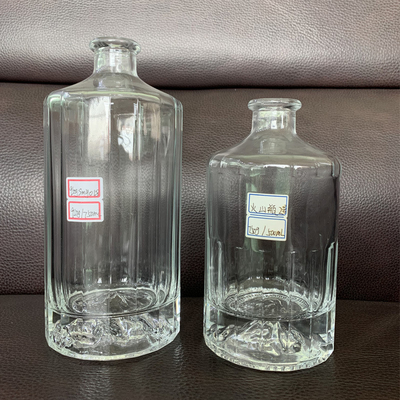 Custom 750ml Embossed Logo Wine Glass Bottle in Clear Color for Branded Whisky